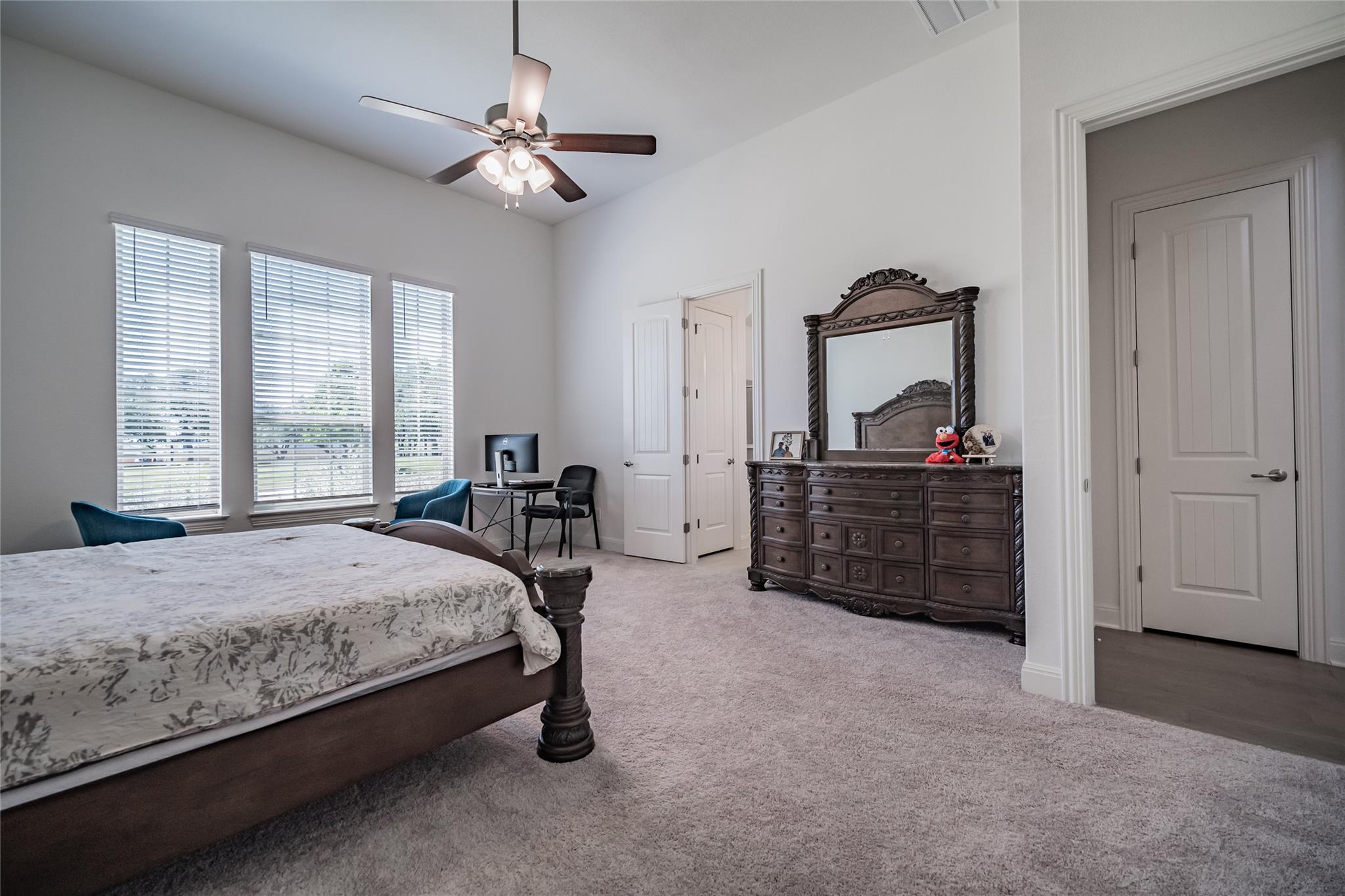 3049 Sage Ranch Drive Leander, TX 78641 - Photo 23 of 23 A spacious bedroom provides a restful retreat with multiple windows offering natural light.