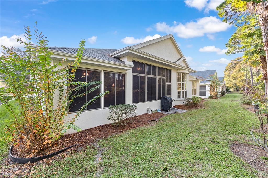 11621 Southwest 72nd Circle Ocala, FL 34476 - Photo 46 of 66 a view of a house with backyard and garden