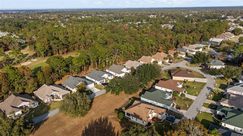 11621 Southwest 72nd Circle Ocala, FL 34476 - Photo 61 of 66 an aerial view of residential building with parking space