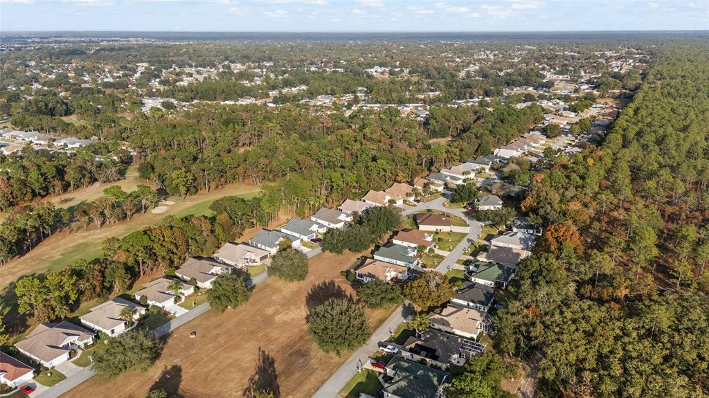 11621 Southwest 72nd Circle Ocala, FL 34476 - Photo 62 of 66 an aerial view of residential houses with outdoor space
