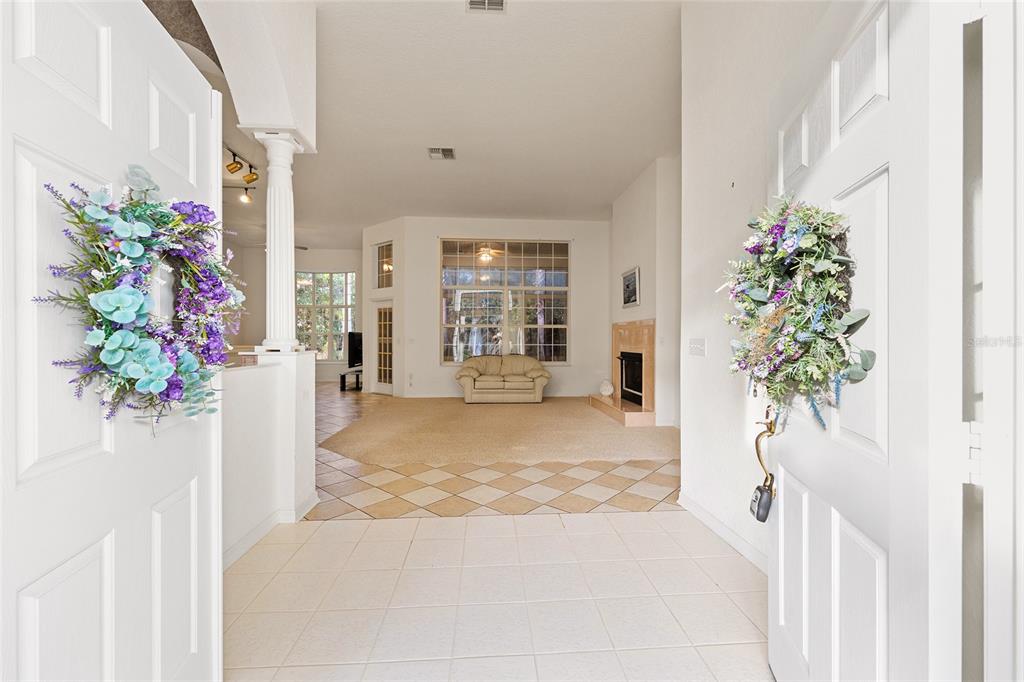 11621 Southwest 72nd Circle Ocala, FL 34476 - Photo 9 of 66 a view of a porch with furniture and a potted plant