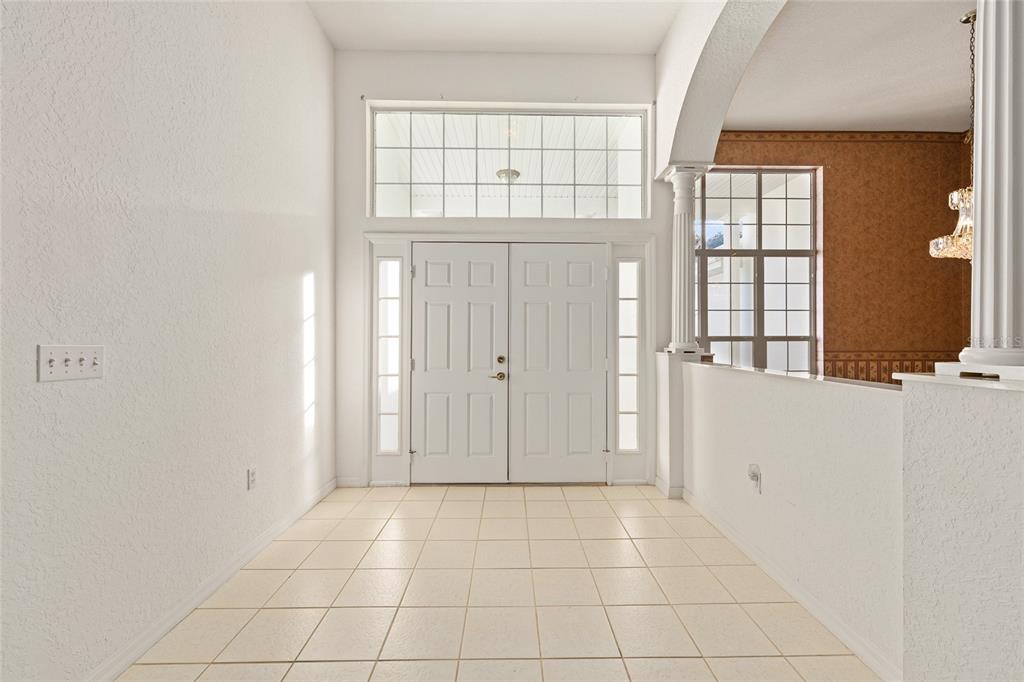 11621 Southwest 72nd Circle Ocala, FL 34476 - Photo 10 of 66 a view of an empty room with windows