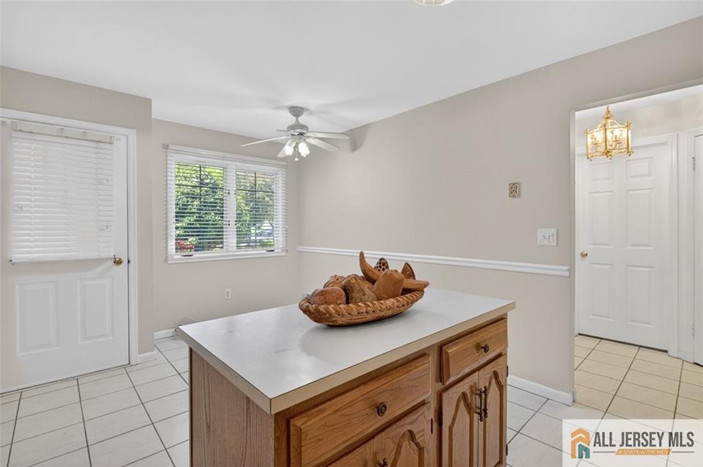 40C Rutland Lane, Unit 40B Monroe Township, NJ 08831 - Photo 13 of 37 a room with a table and a window