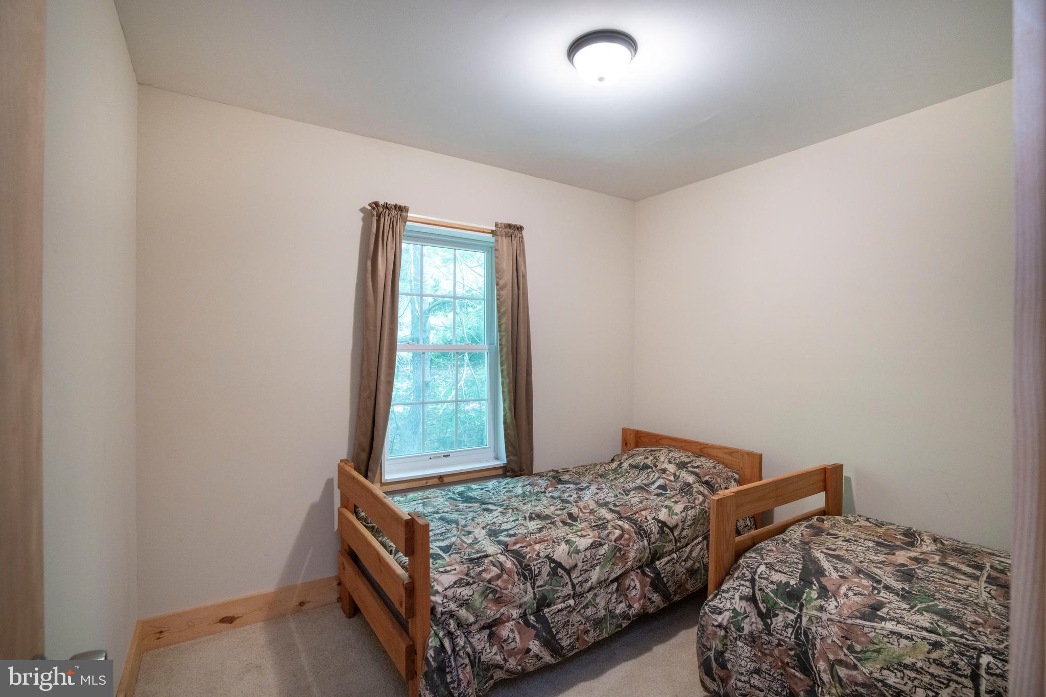 385 Elk Creek Road Aaronsburg, PA 16820 - Photo 45 of 71 a bedroom with a bed and a window
