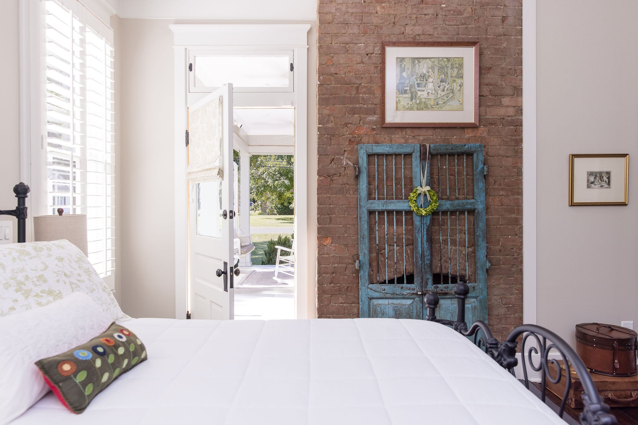 200 Battle Avenue Franklin, TN 37064 - Photo 37 of 95 a bedroom with a bed a table and painting on the wall