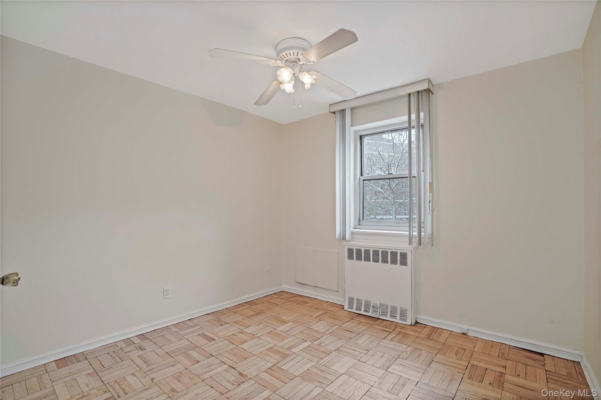 151-31 88th Street, Unit 1B Queens, NY 11414 - Photo 12 of 24 a view of an empty room with a window