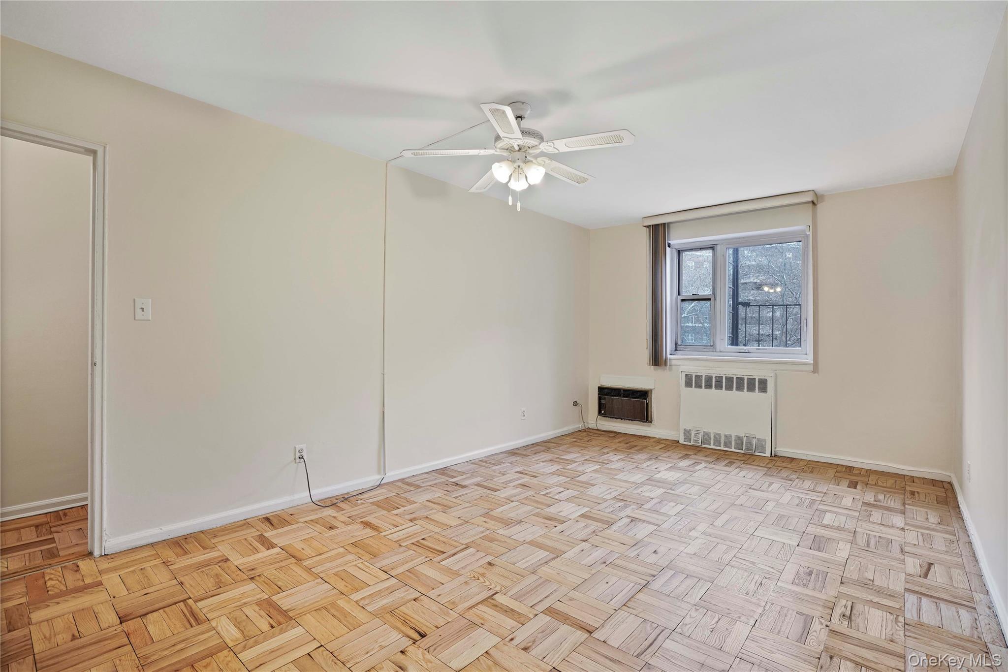 151-31 88th Street, Unit 1B Queens, NY 11414 - Photo 16 of 24 a view of empty room with a ceiling fan