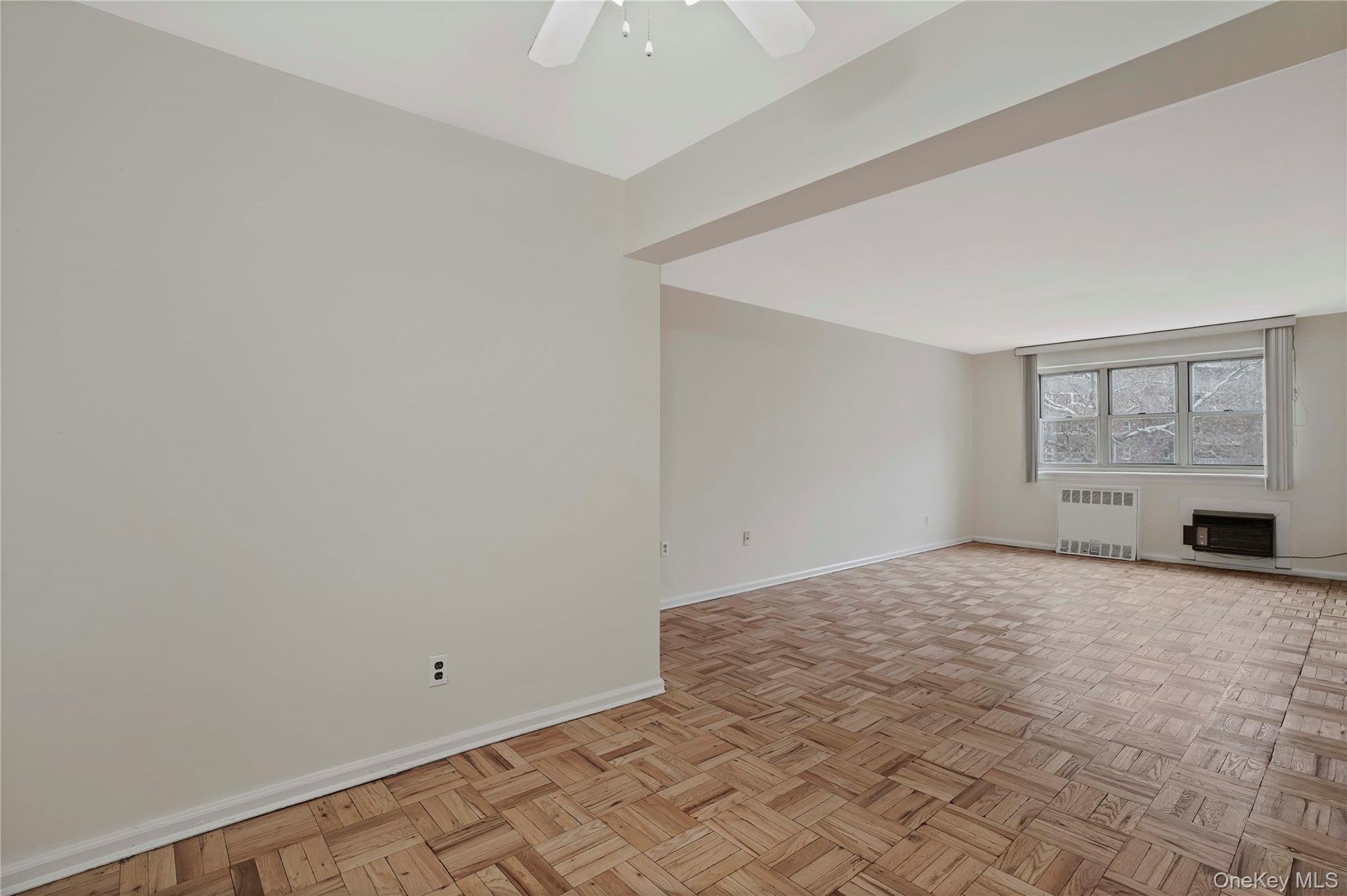 151-31 88th Street, Unit 1B Queens, NY 11414 - Photo 3 of 24 a view of an empty room with a window