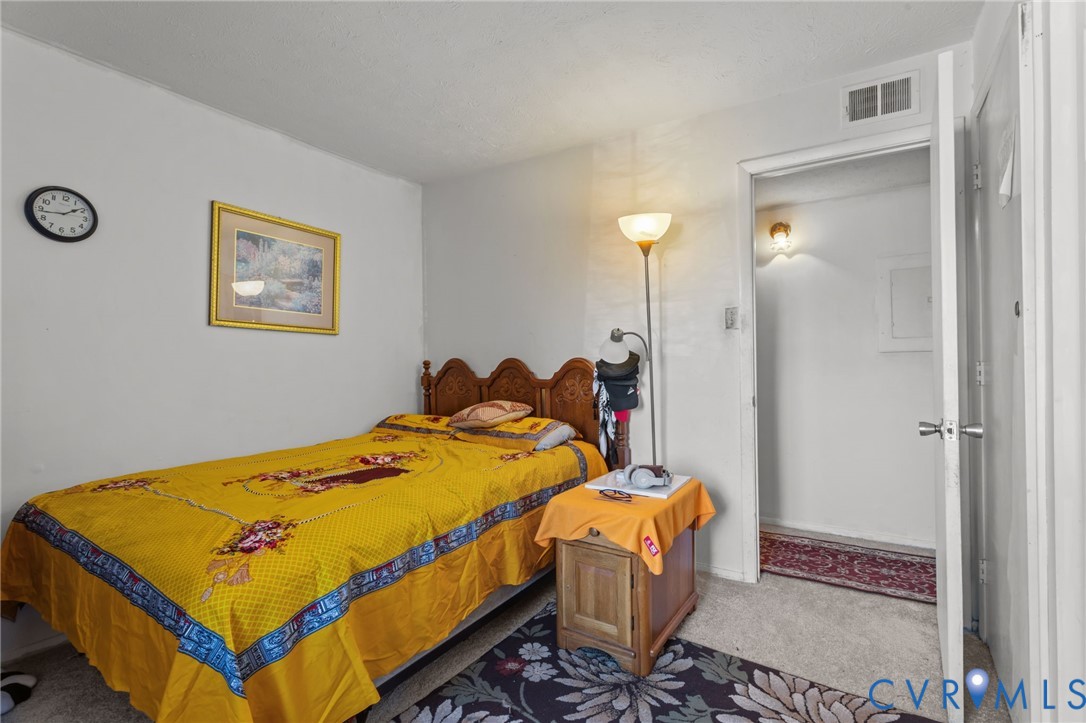 1503 Largo Road, Unit 201 Richmond, VA 23238 - Photo 11 of 37 a bed room with a bed and a painting
