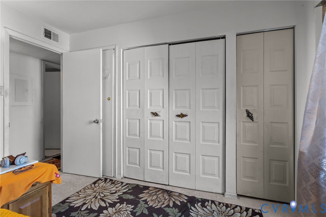 1503 Largo Road, Unit 201 Richmond, VA 23238 - Photo 13 of 37 a bedroom with a bed and a shower