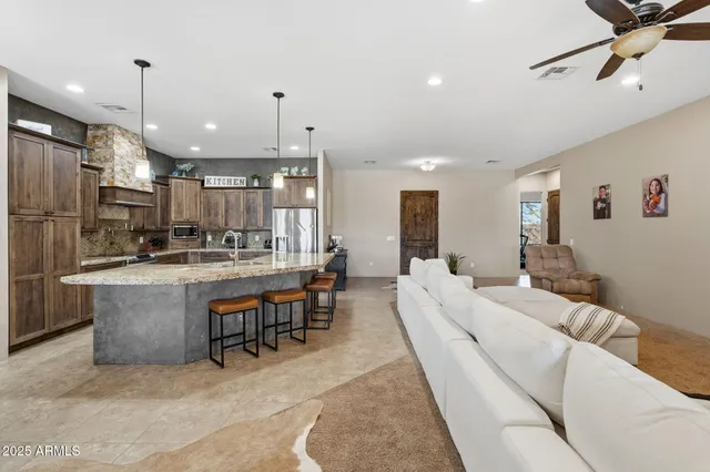 a large kitchen with a table and chairs