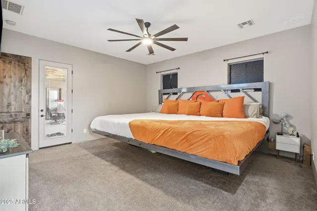 a bedroom with a bed and window