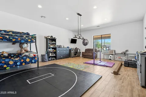 a bedroom with furniture and a chandelier