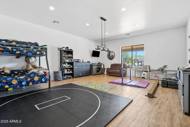 a bedroom with furniture and a chandelier