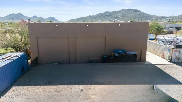 a living room with furniture and a gym equipment