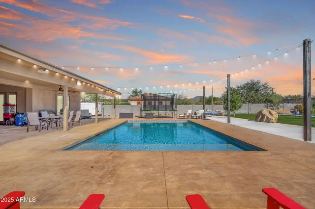 a view of a swimming pool with a patio