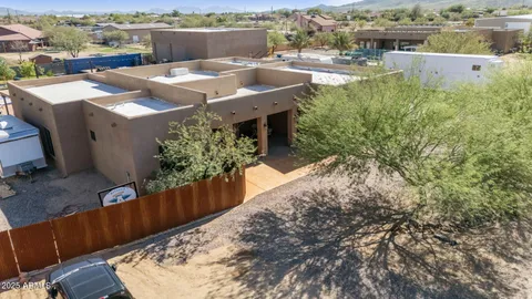 an aerial view of a house with swimming pool