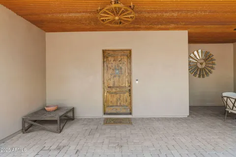 a view of a room with table and a chair