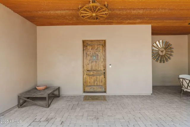a view of a room with table and a chair