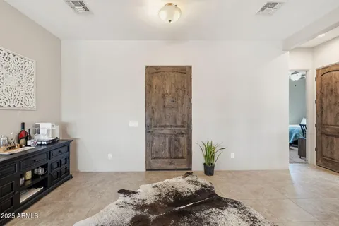 a bedroom with a bed and a dresser