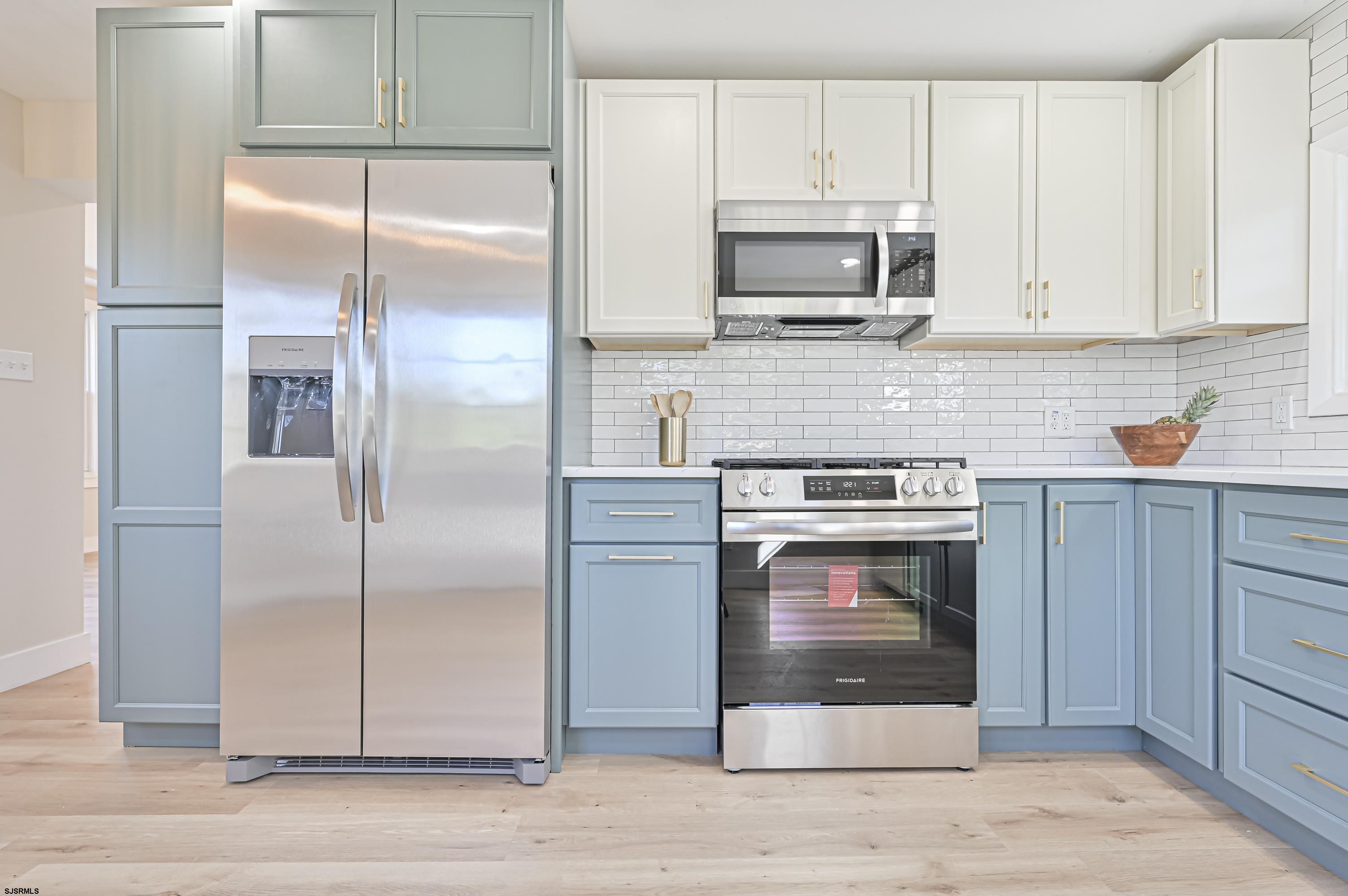 5906 Gaskill Street Mays Landing, NJ 08330 - Photo 17 of 39 a kitchen with stainless steel appliances granite countertop a refrigerator stove and sink