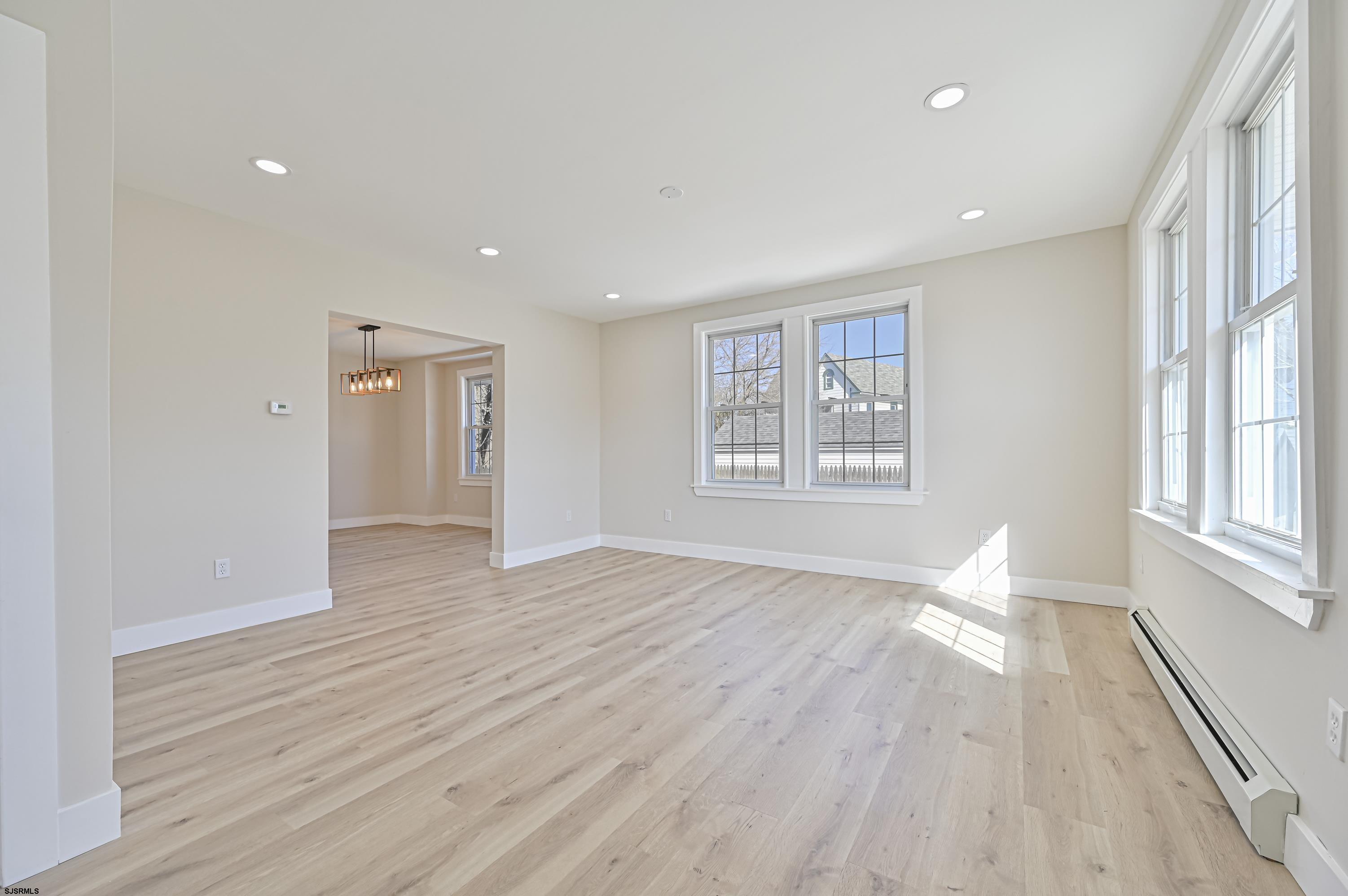 5906 Gaskill Street Mays Landing, NJ 08330 - Photo 4 of 39 a view of an empty room with wooden floor and a window