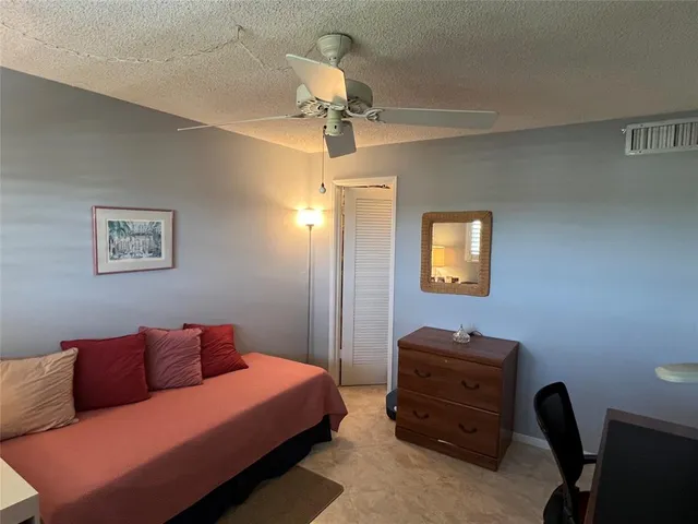 a patio with a yard table and chairs