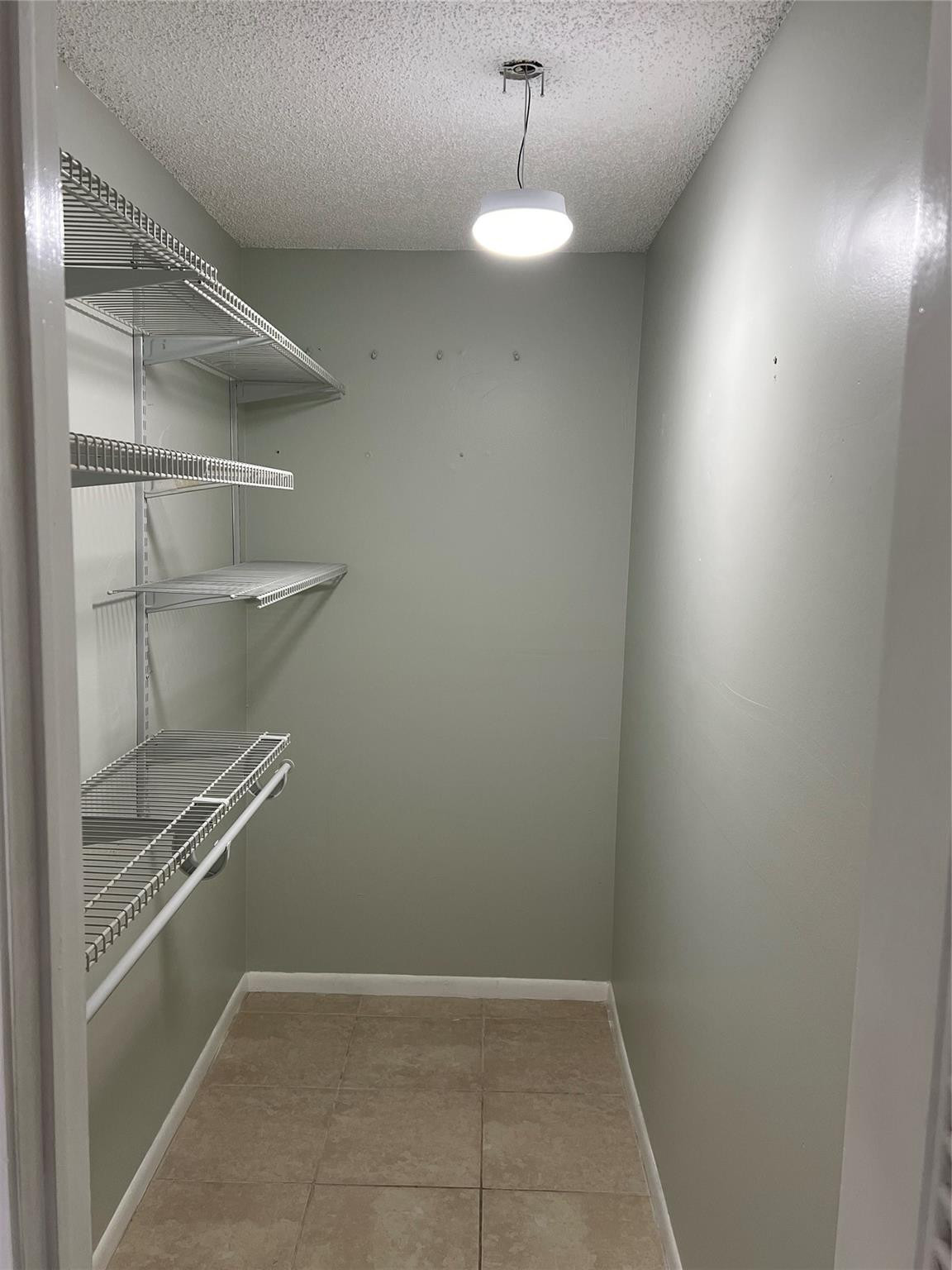 9920 Northwest 68th Place, Unit 210 Tamarac, FL 33321 - Photo 14 of 26 PRIMARY CLOSET