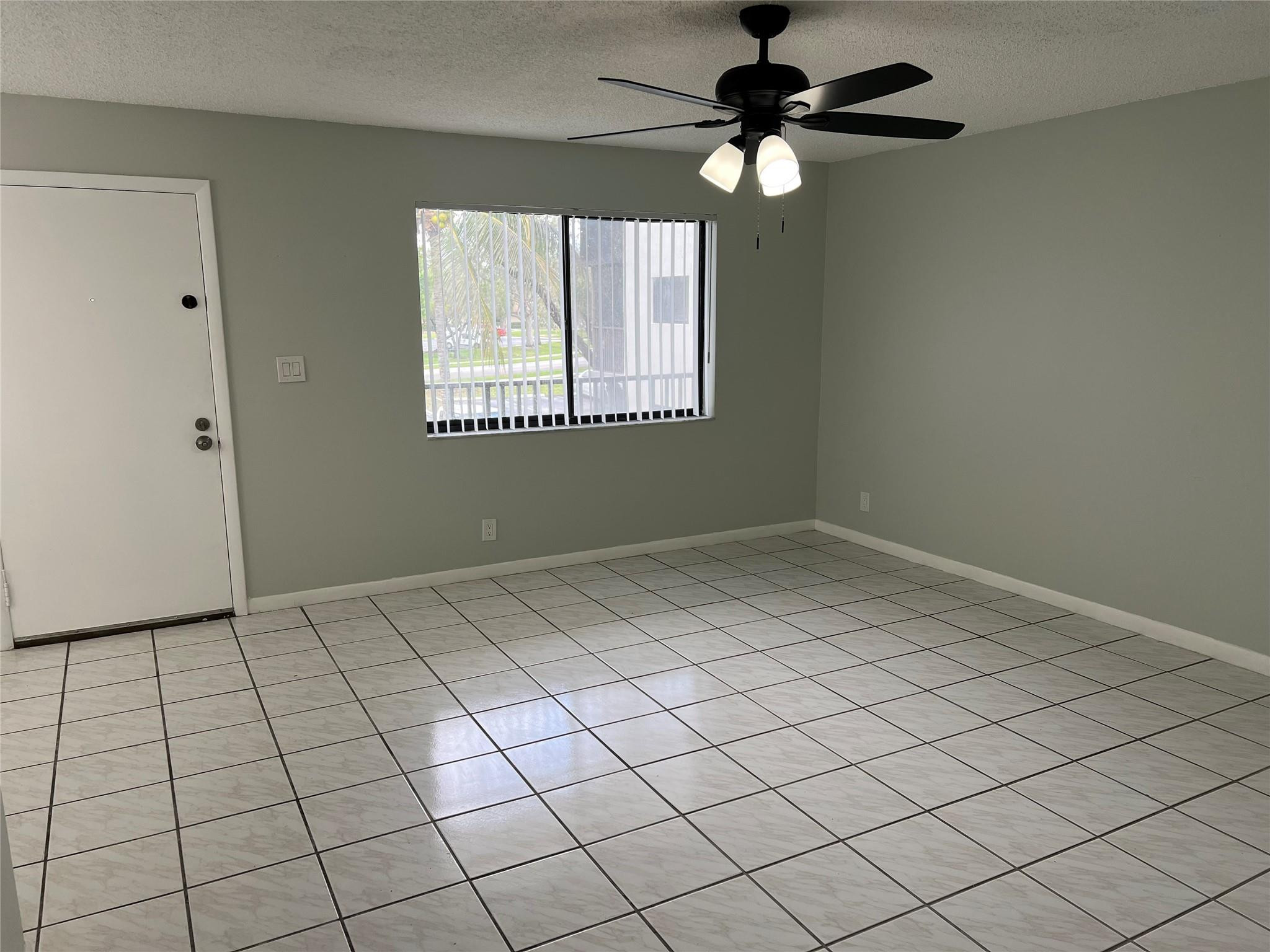 9920 Northwest 68th Place, Unit 210 Tamarac, FL 33321 - Photo 3 of 26 LIVING/FAILY ROOM