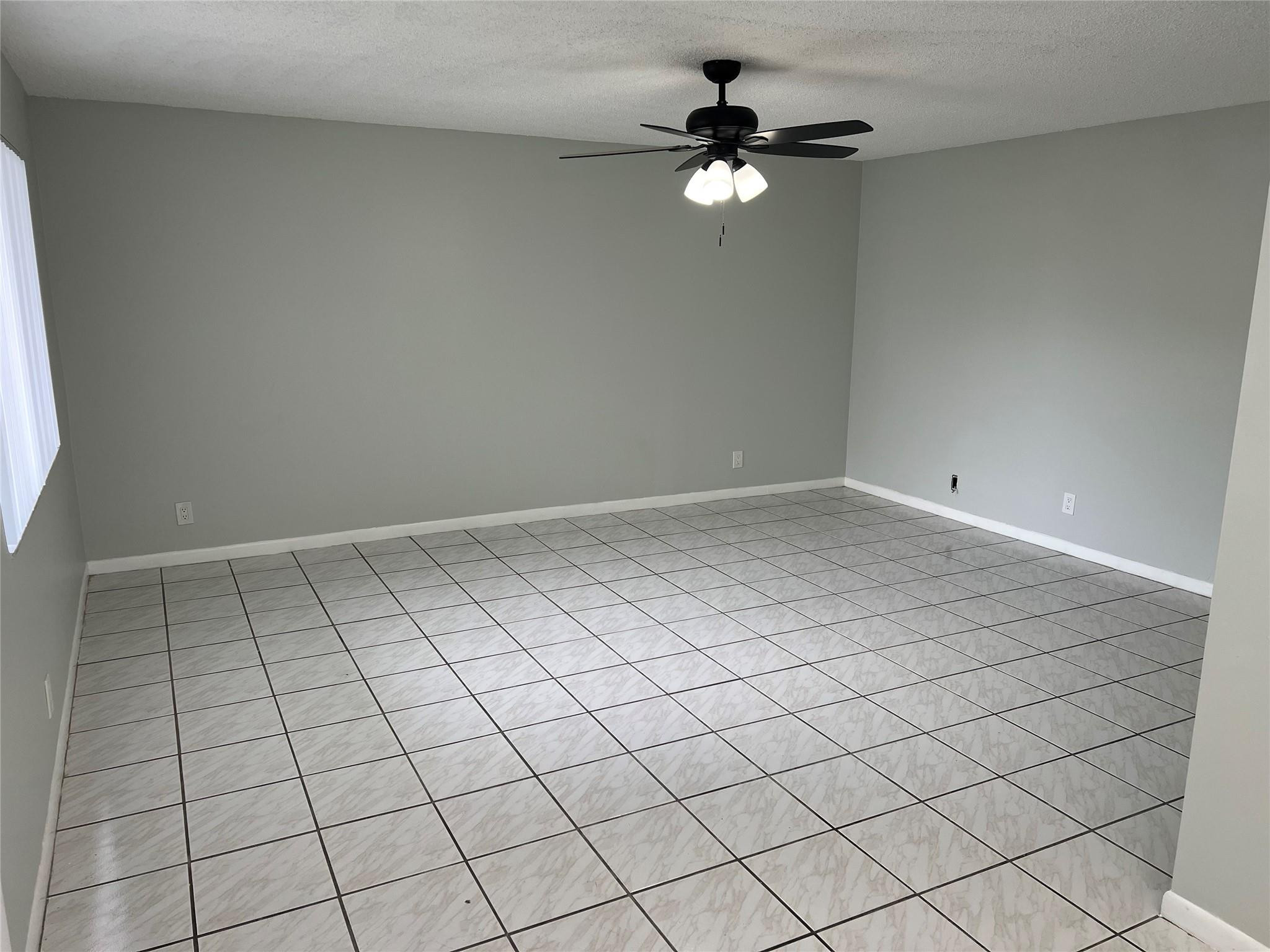9920 Northwest 68th Place, Unit 210 Tamarac, FL 33321 - Photo 4 of 26 LIVING/FAMILY ROOM