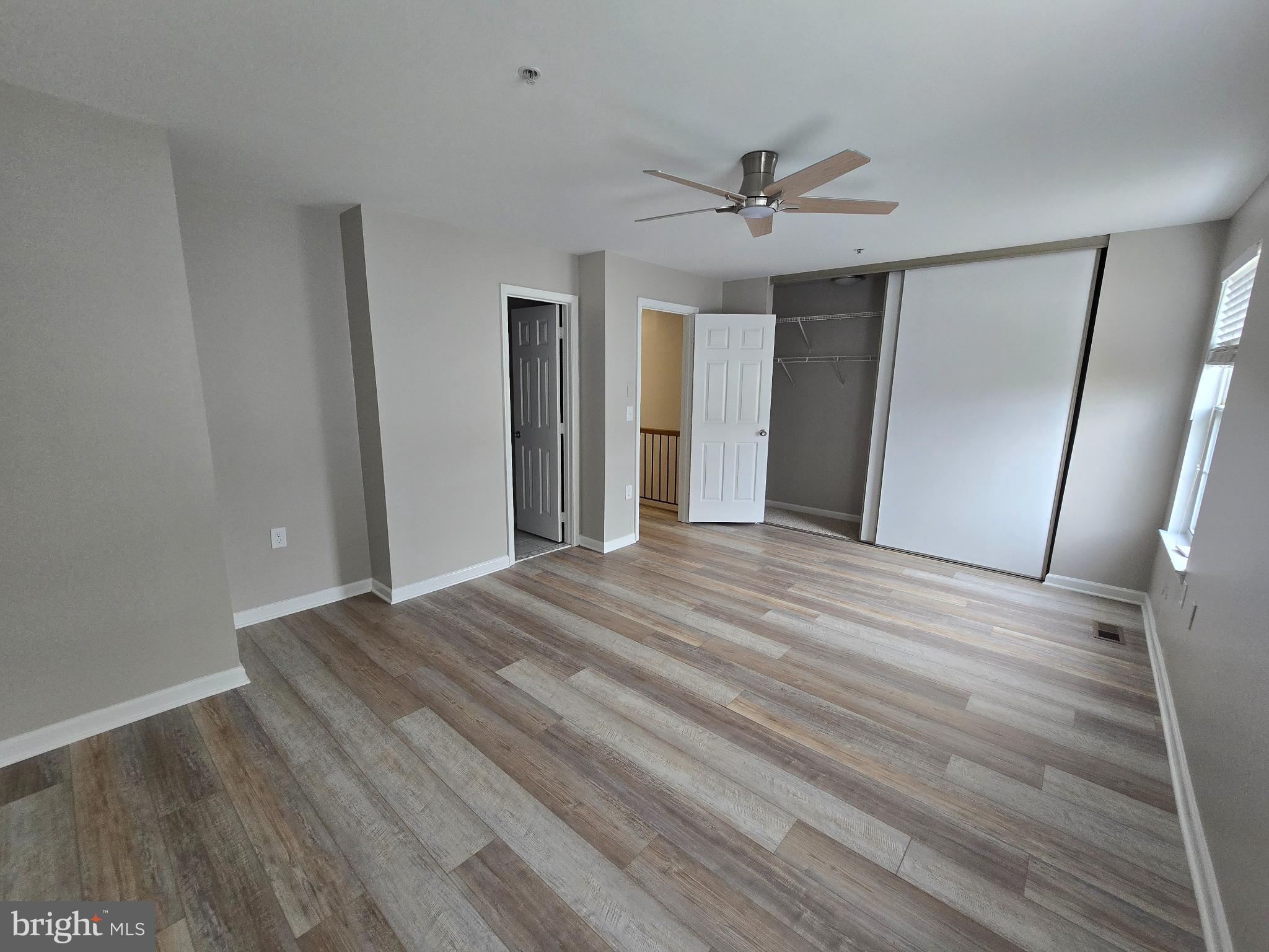 1105 Simsbury Court Crofton, MD 21114 - Photo 13 of 15 a view of a livingroom with wooden floor and window