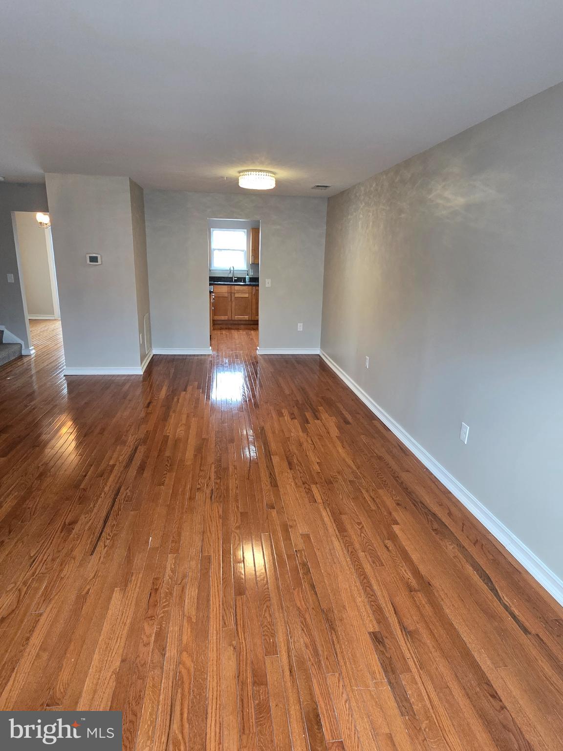 1105 Simsbury Court Crofton, MD 21114 - Photo 7 of 15 a view of empty room with wooden floor