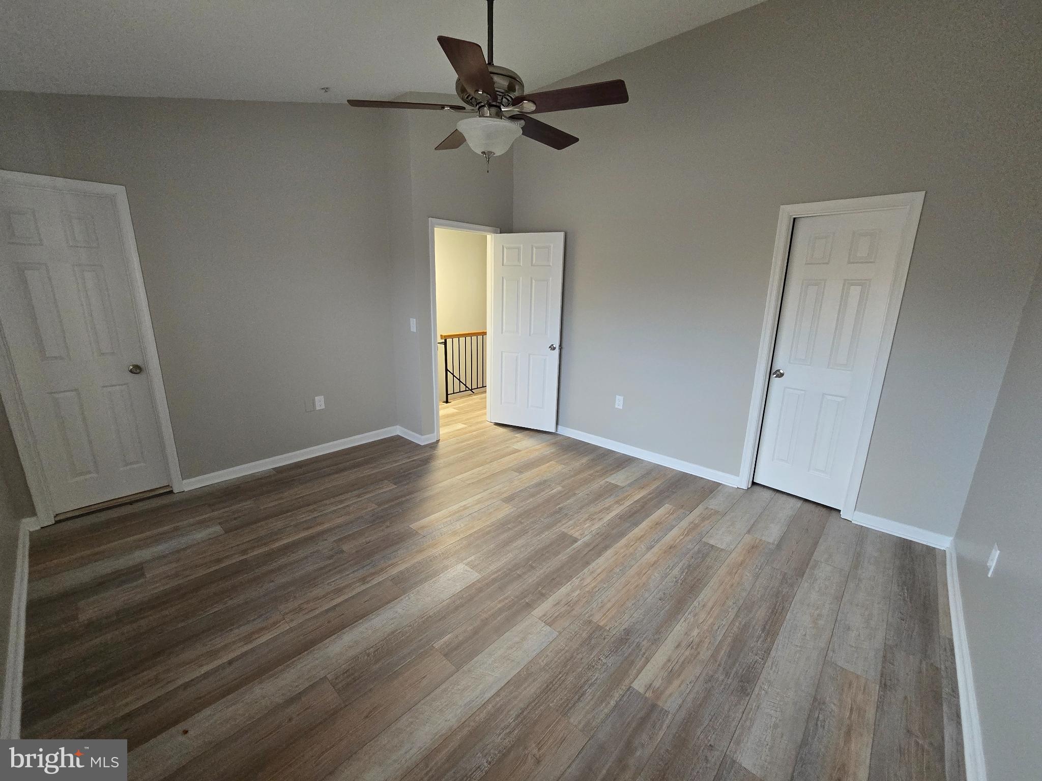 1105 Simsbury Court Crofton, MD 21114 - Photo 8 of 15 wooden floor in an empty room with a window