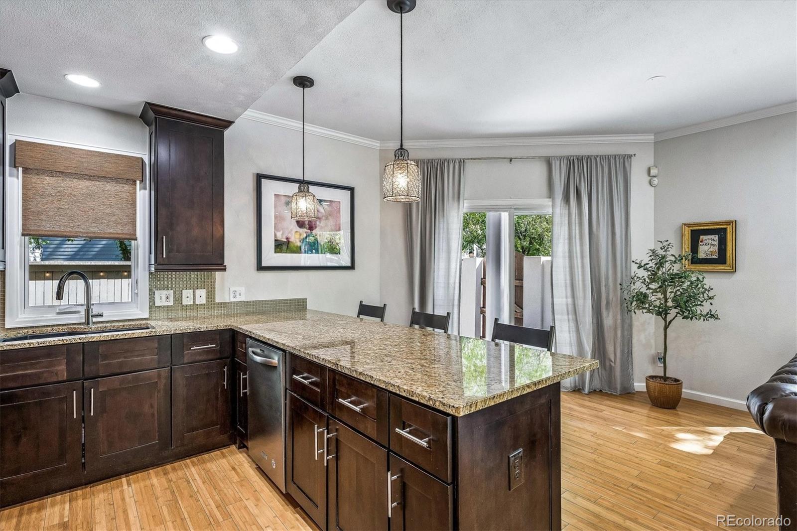 155 South Jackson Street, Unit A Denver, CO 80209 - Photo 11 of 40 a kitchen with a sink stove and cabinets