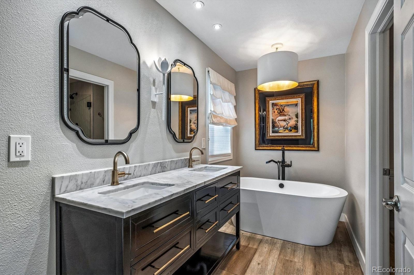 155 South Jackson Street, Unit A Denver, CO 80209 - Photo 17 of 40 a bathroom with a double vanity sink and a mirror