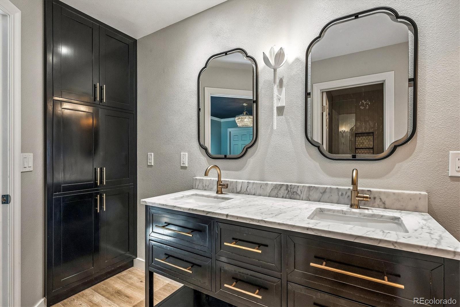 155 South Jackson Street, Unit A Denver, CO 80209 - Photo 20 of 40 a bathroom with a double vanity sink and a mirror