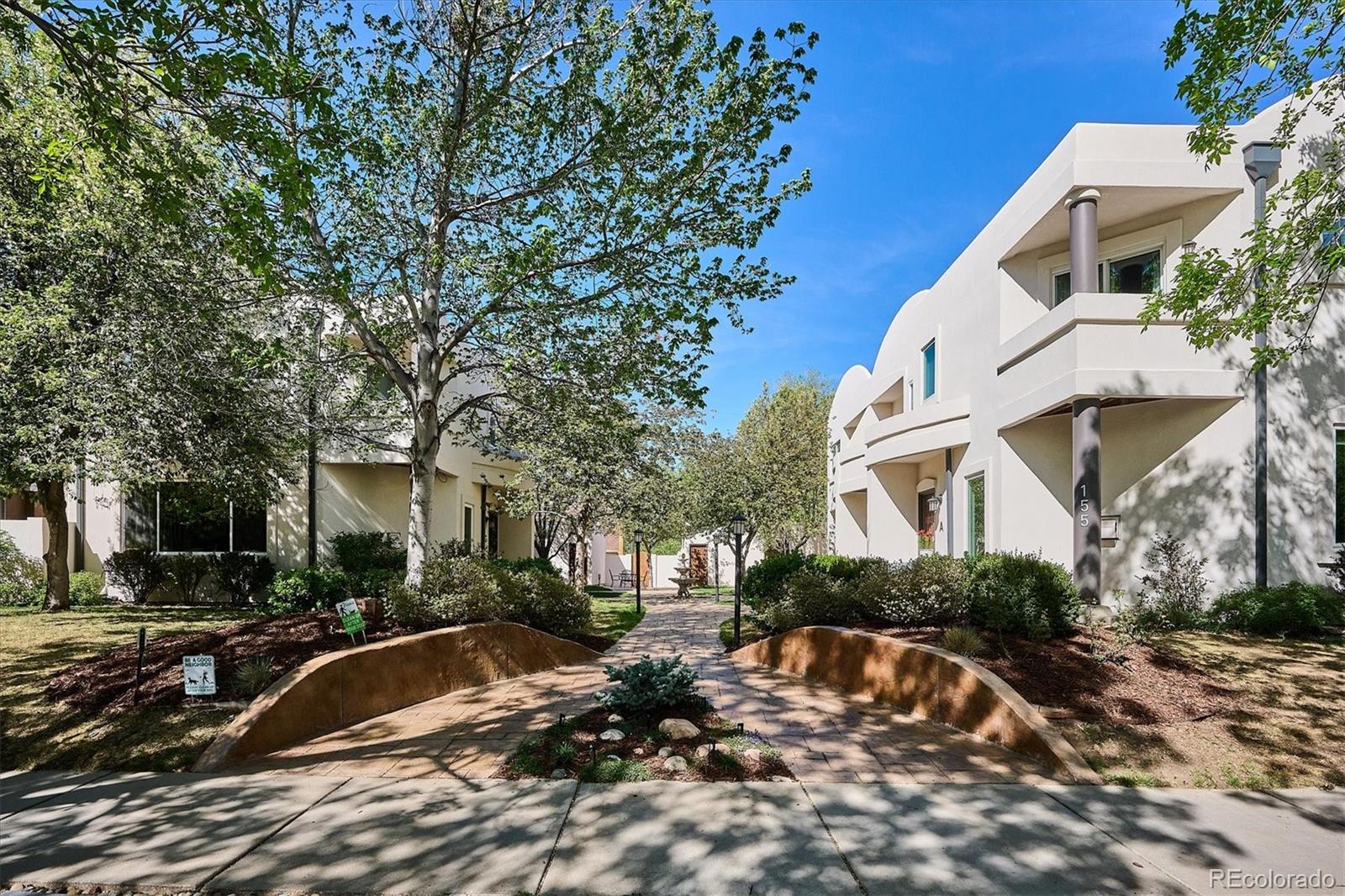 155 South Jackson Street, Unit A Denver, CO 80209 - Photo 2 of 40 a view of a house with a patio