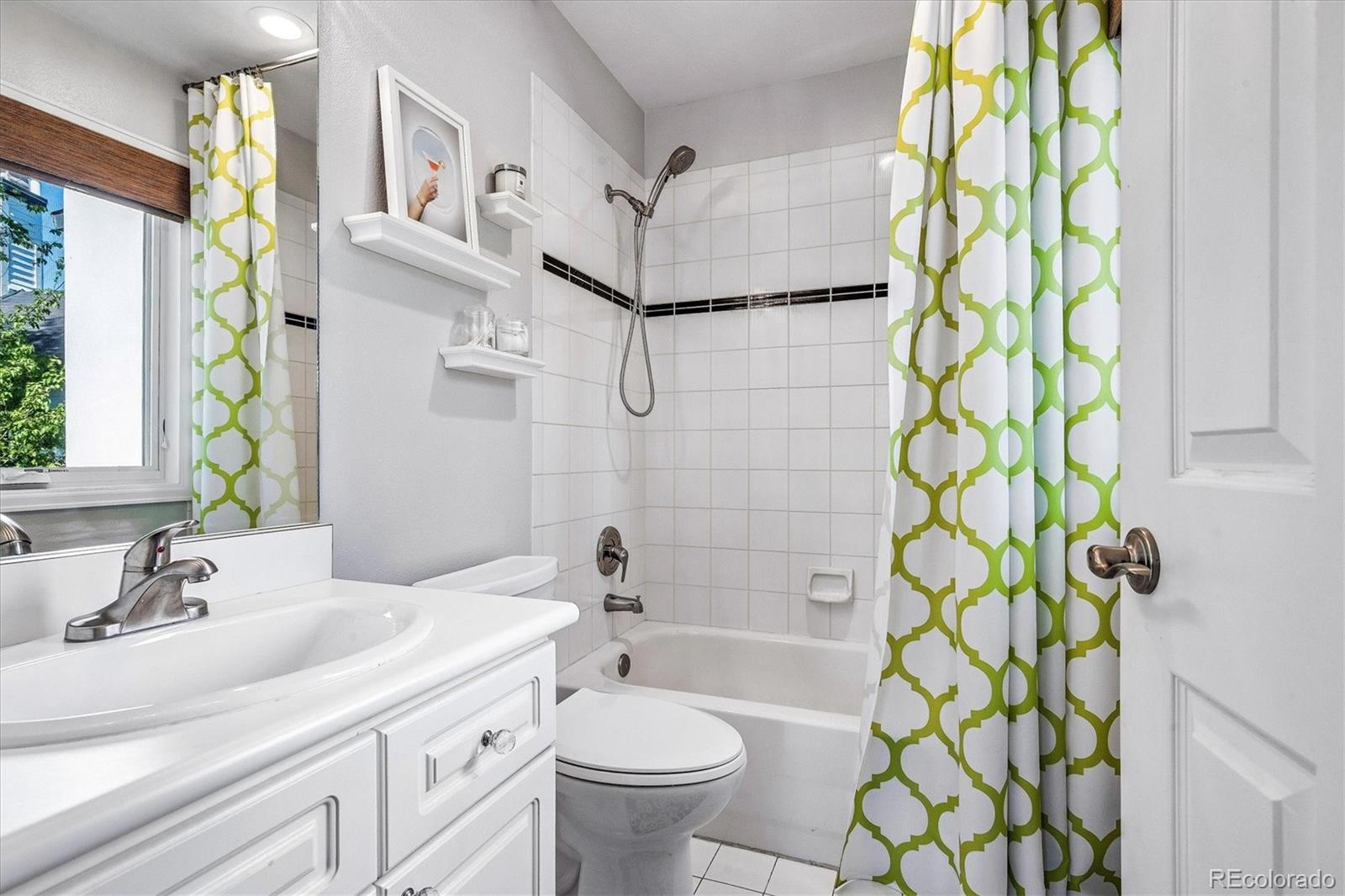 155 South Jackson Street, Unit A Denver, CO 80209 - Photo 22 of 40 a bathroom with a sink toilet and shower