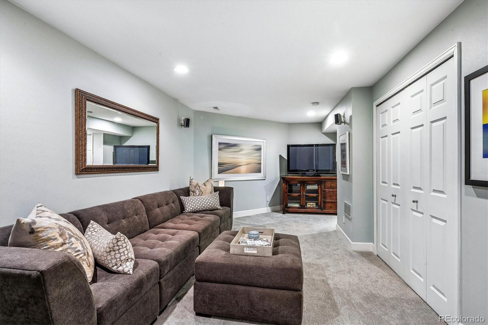 155 South Jackson Street, Unit A Denver, CO 80209 - Photo 26 of 40 a living room with furniture and a flat screen tv