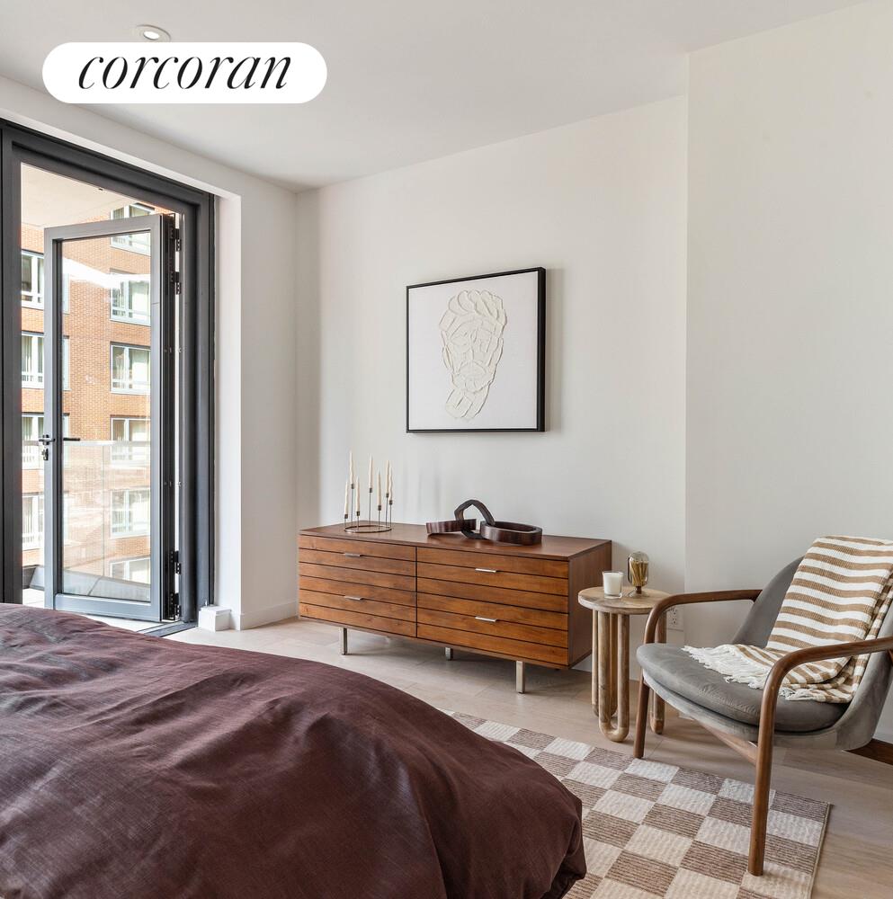 355 West 39th Street, Unit 7A Manhattan, NY 10018 - Photo 6 of 9 a bedroom with furniture and a window