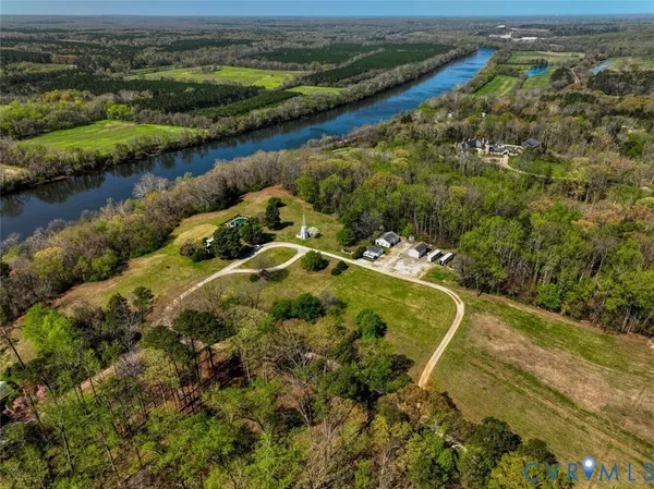 an aerial view of a residential houses with outdoor space