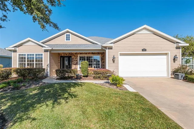 a view of a house with backyard and porch
