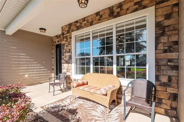 a view of a dining room with furniture wooden floor and chandelier