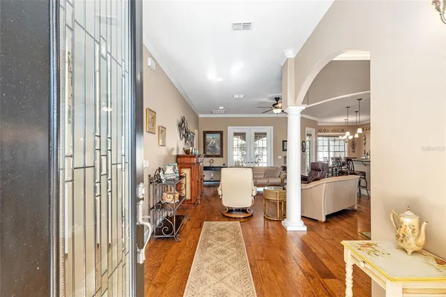 a view of a dining room with furniture and window
