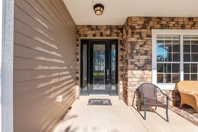 a kitchen with stainless steel appliances kitchen island granite countertop a stove a sink and a refrigerator