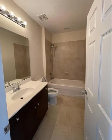 a living room with furniture and windows