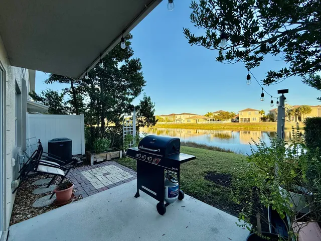 a view of a lake with houses in the back