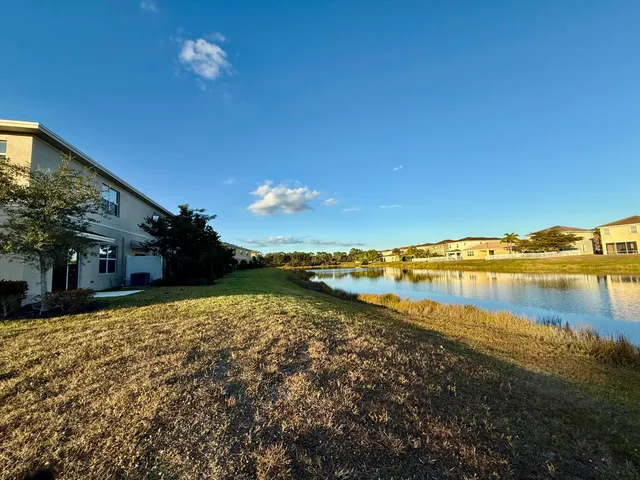 a view of a lake with houses in the back