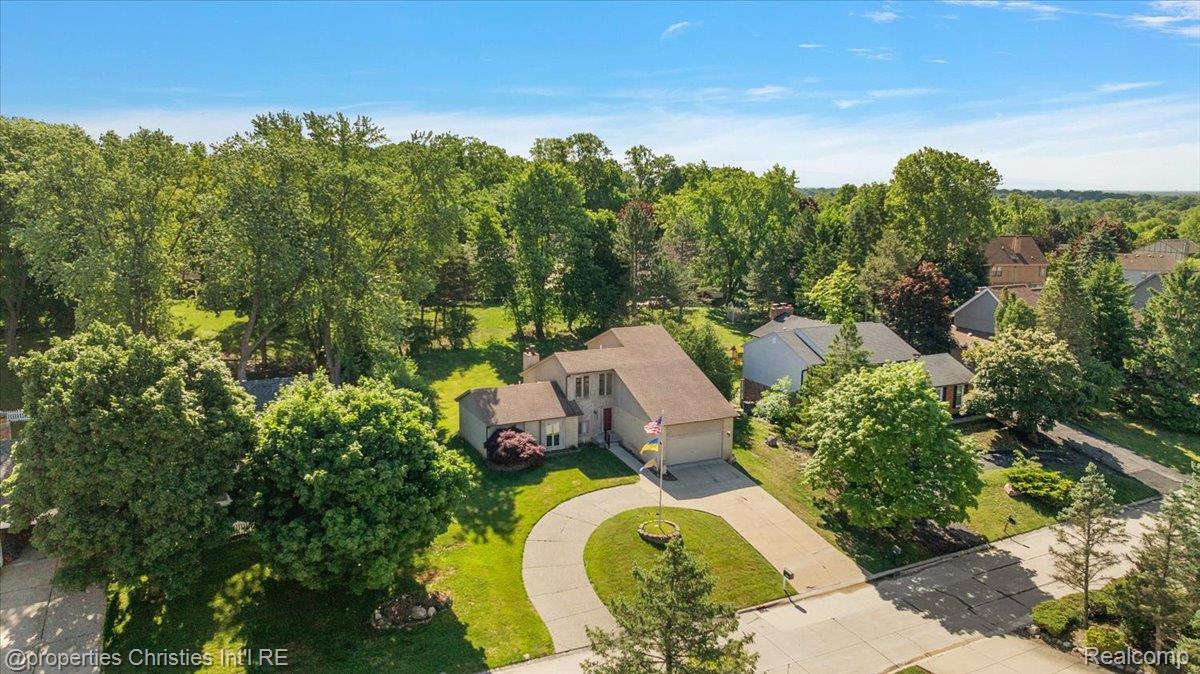 37224 Chesapeake Road Farmington, MI 48335 - Photo 14 of 50 Aerial perspective showcasing a residential property with a circular driveway and an attached garage