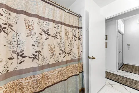 a bathroom with a bathtub and shower